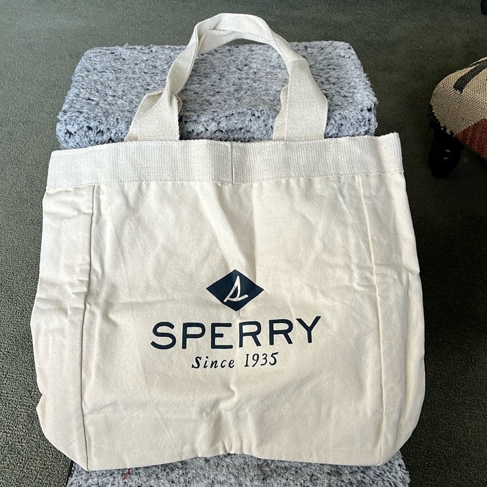 Sperry canvas tote.  Measures 19” x 16”.  Brand new!